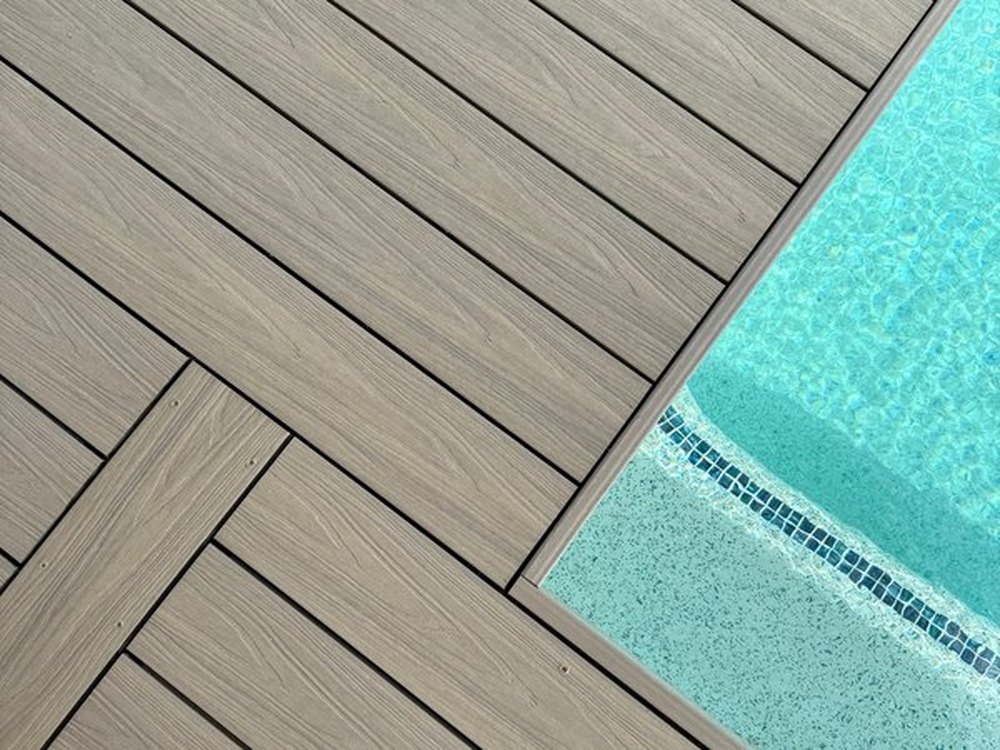 Composite decking laid to the pool edge, Ekodeck designer series