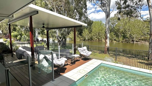 Poolside deck and entertaining area looking out over the water
